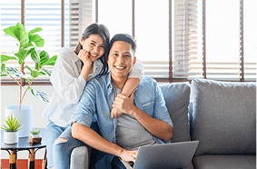 a man and woman sitting on a couch